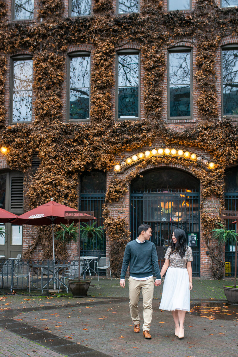 Seattle engagement photos in Pioneer Square, Occidental Park, holiday shoot, rainy engagement photos with clear umbrella, Seattle fashion blogger Just A Tina Bit, midi tulle skirt, embellished top, sequined top