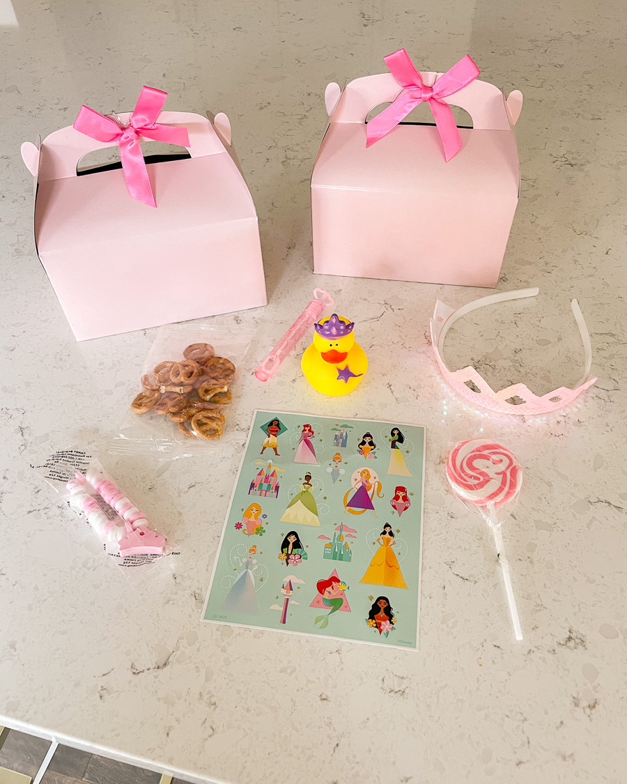 princess party favor, pink party favor boxes, crown candy bracelet, sequin crown, disney princess stickers, princess rubber duck, lollipops, pink bubble wand, what to put inside toddler party favor box